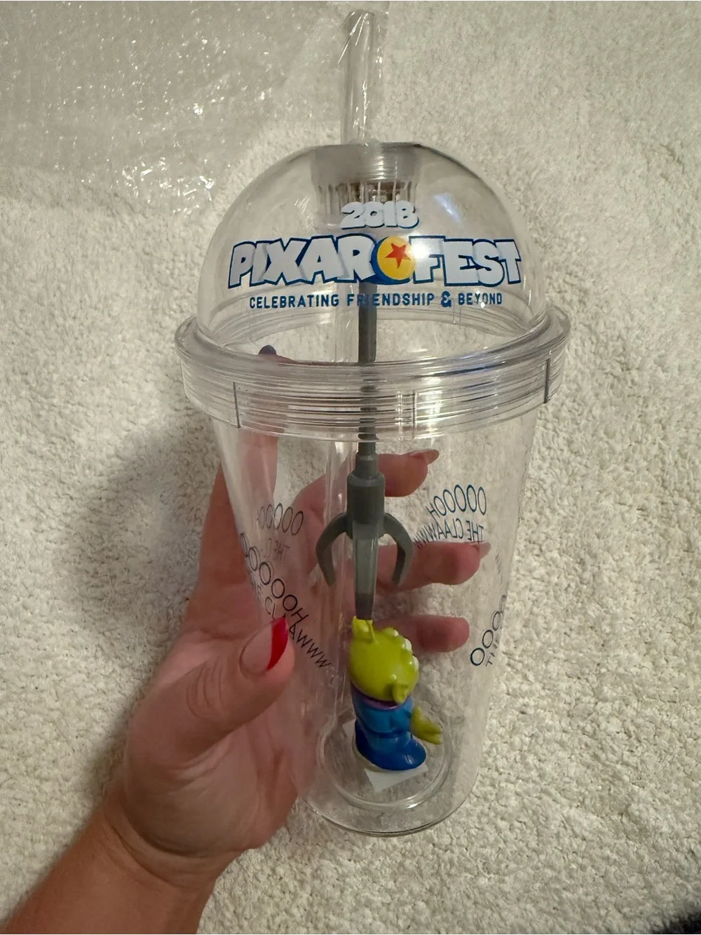 Disney Clear Claw Machine Cup with Green Alien and Blue Outfit